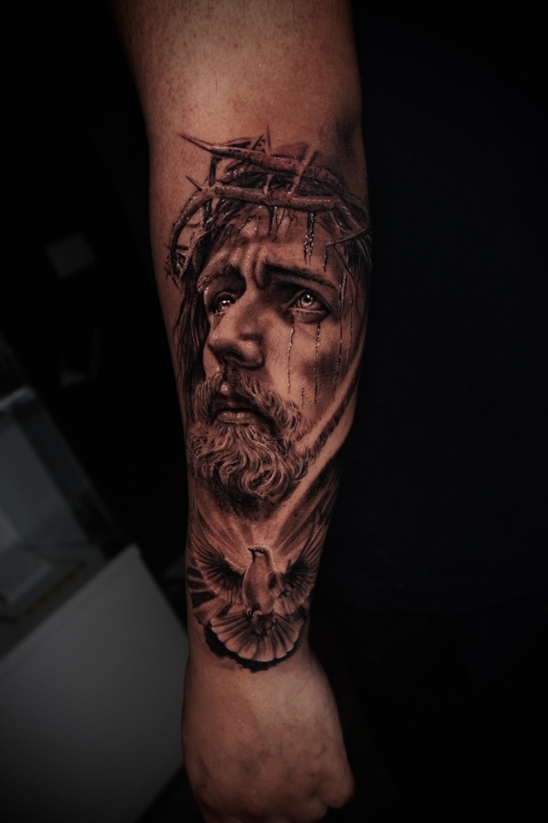 Black and grey portrait of Christ with a crown of thorns and a dove.